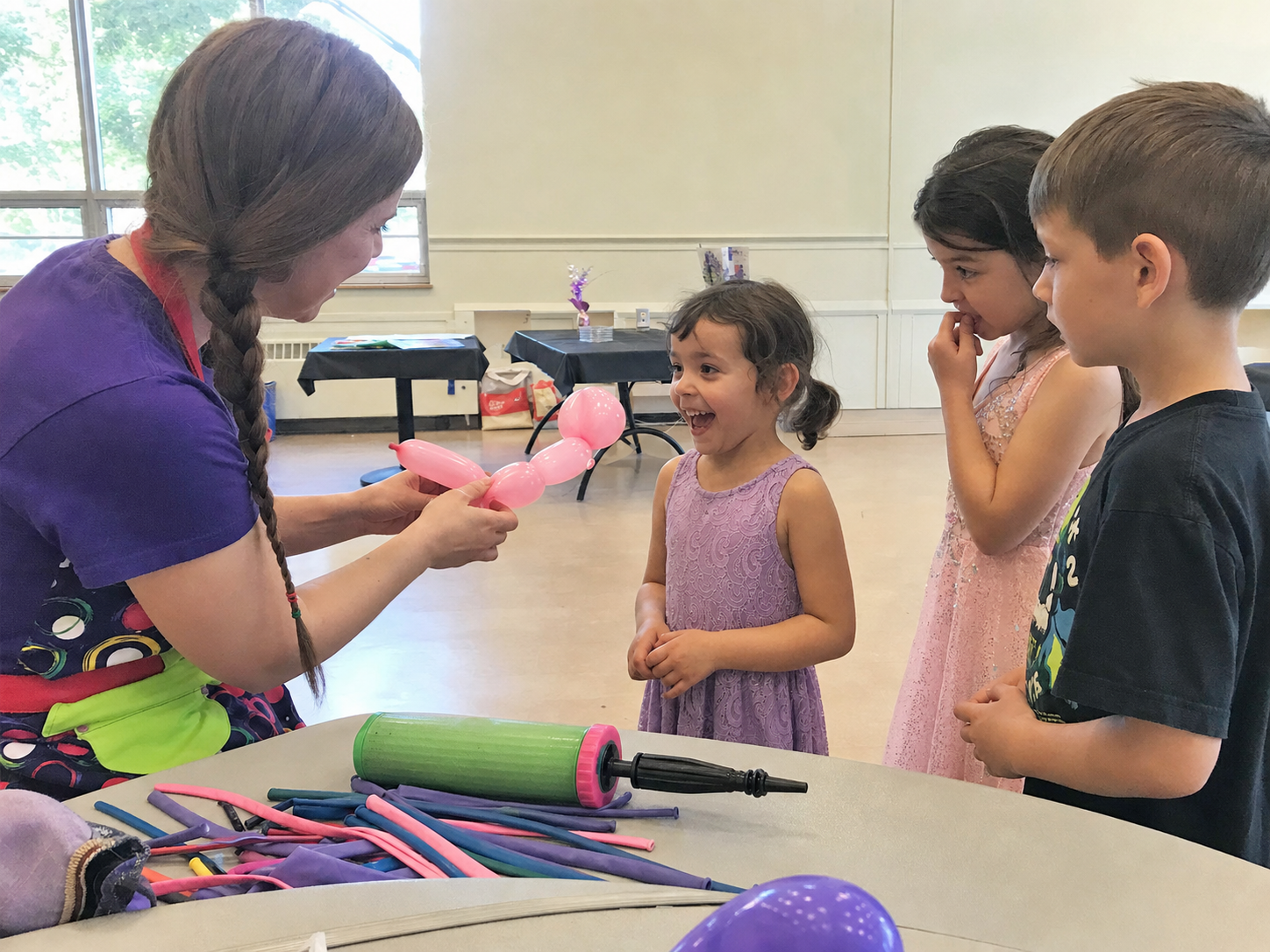 Balloon artist creating a balloon animal